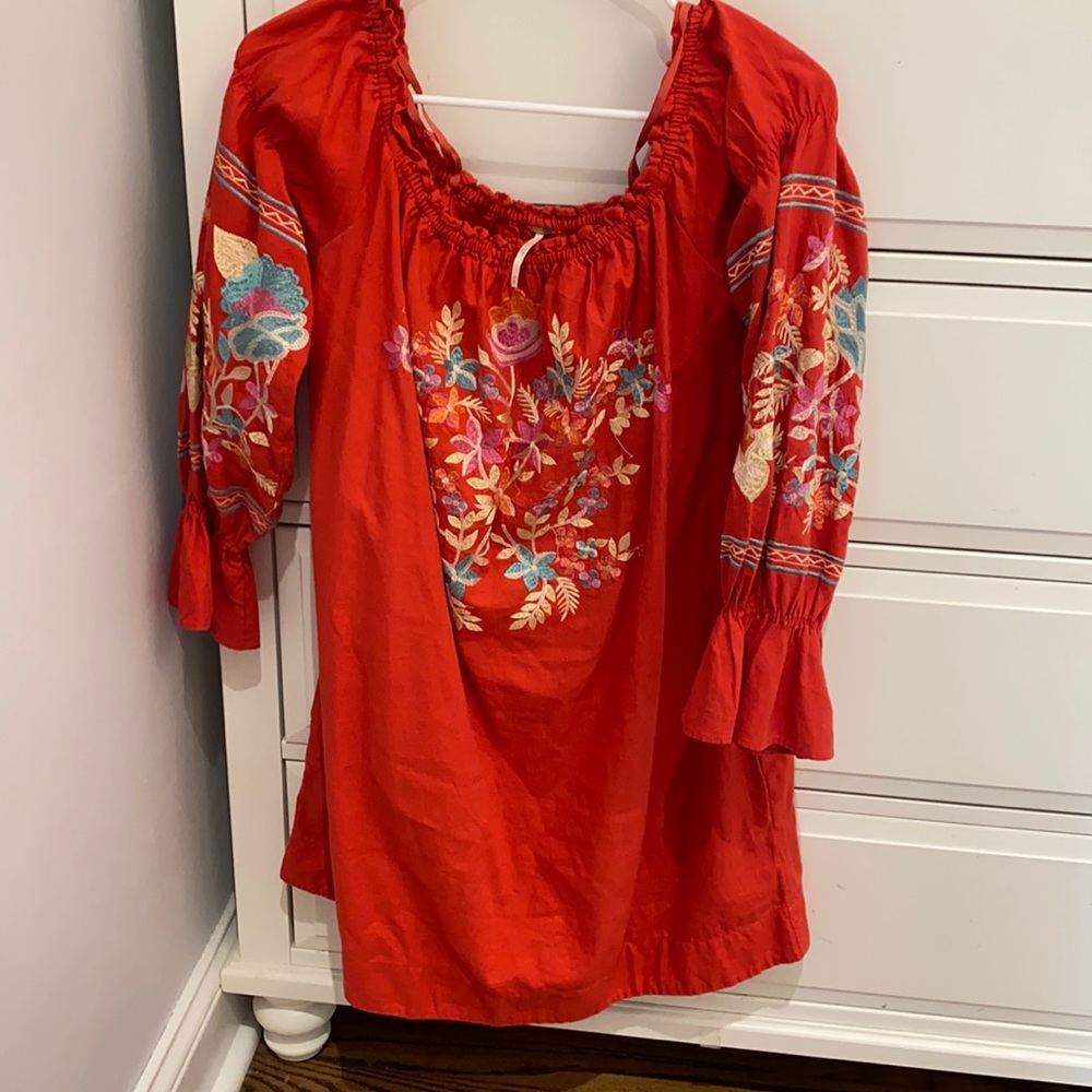 Red dress with embroidered pattern